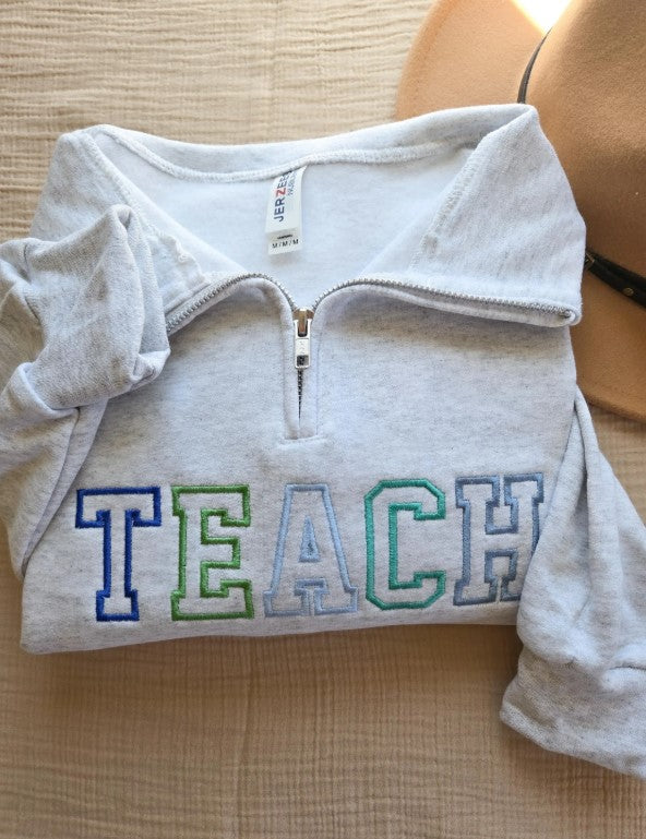 Colorful Varsity Teach Quarter Zip Sweatshirt